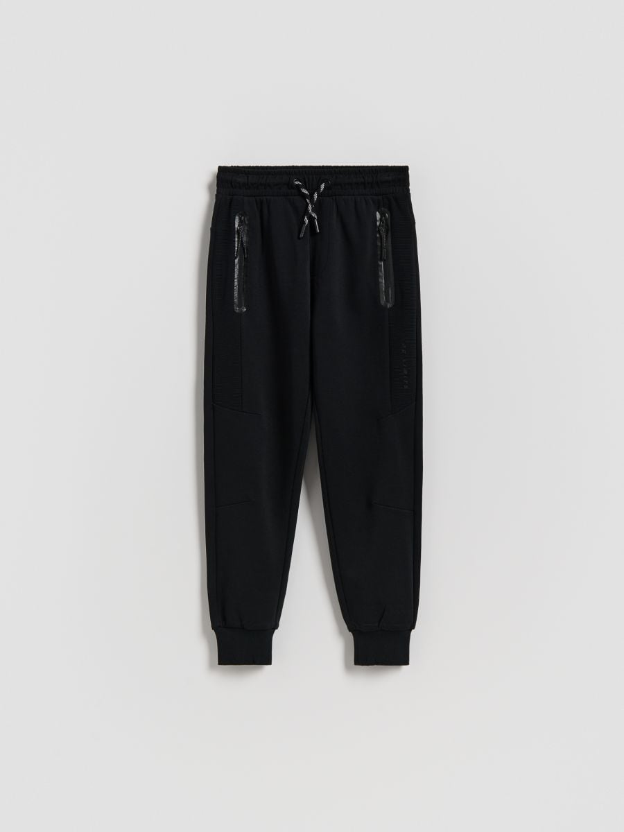 Bawełniane spodnie jogger - czarny - RESERVED