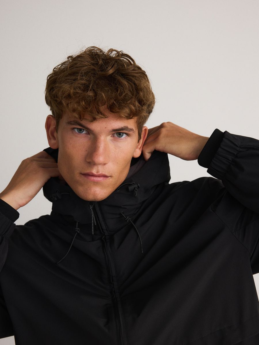 Hooded anorak with ribbing - black - RESERVED