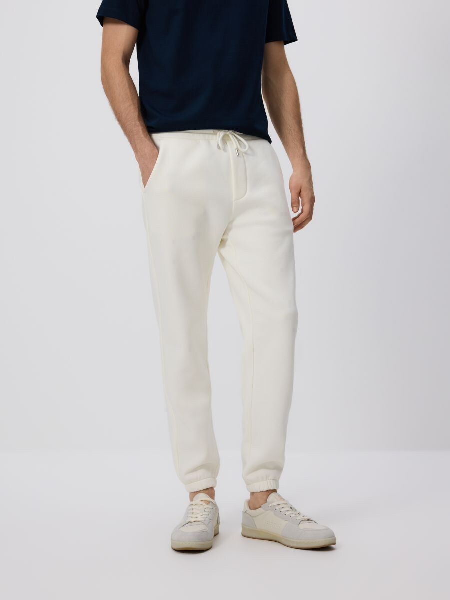 Regular fit tracksuit bottoms - cream - RESERVED
