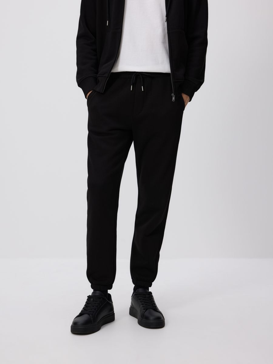 Regular fit tracksuit bottoms - black - RESERVED