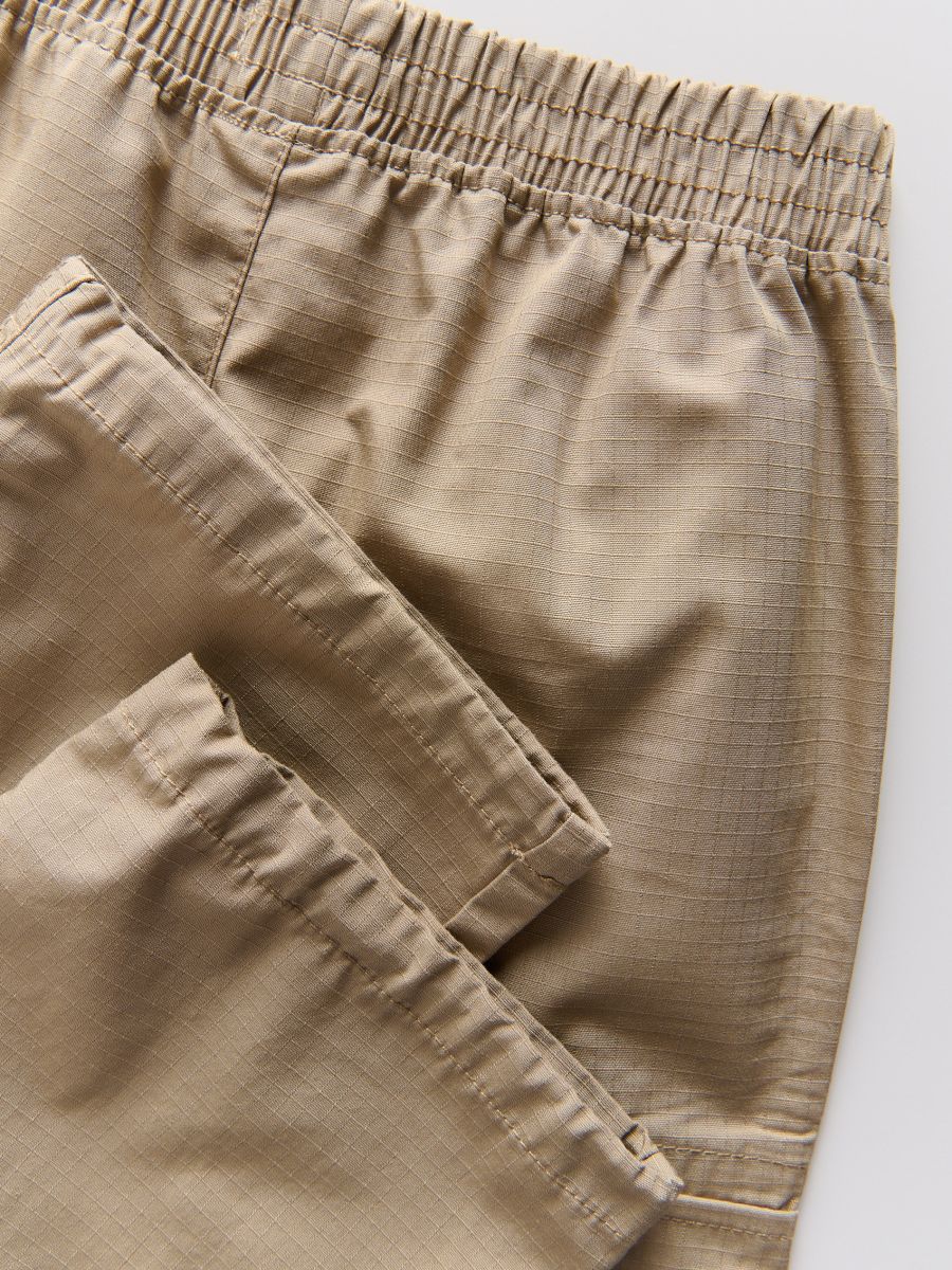 Cargo trousers with pockets - beige - RESERVED - 2