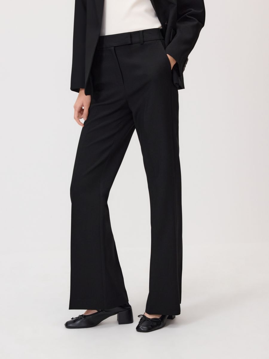 Flare trousers with pressed crease - black - RESERVED