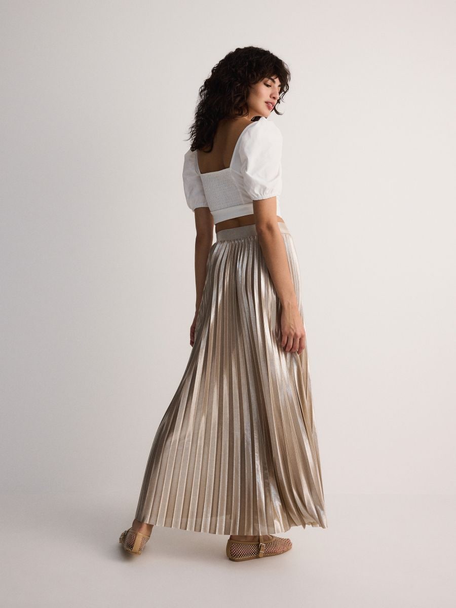 Gold tone pleated maxi skirt