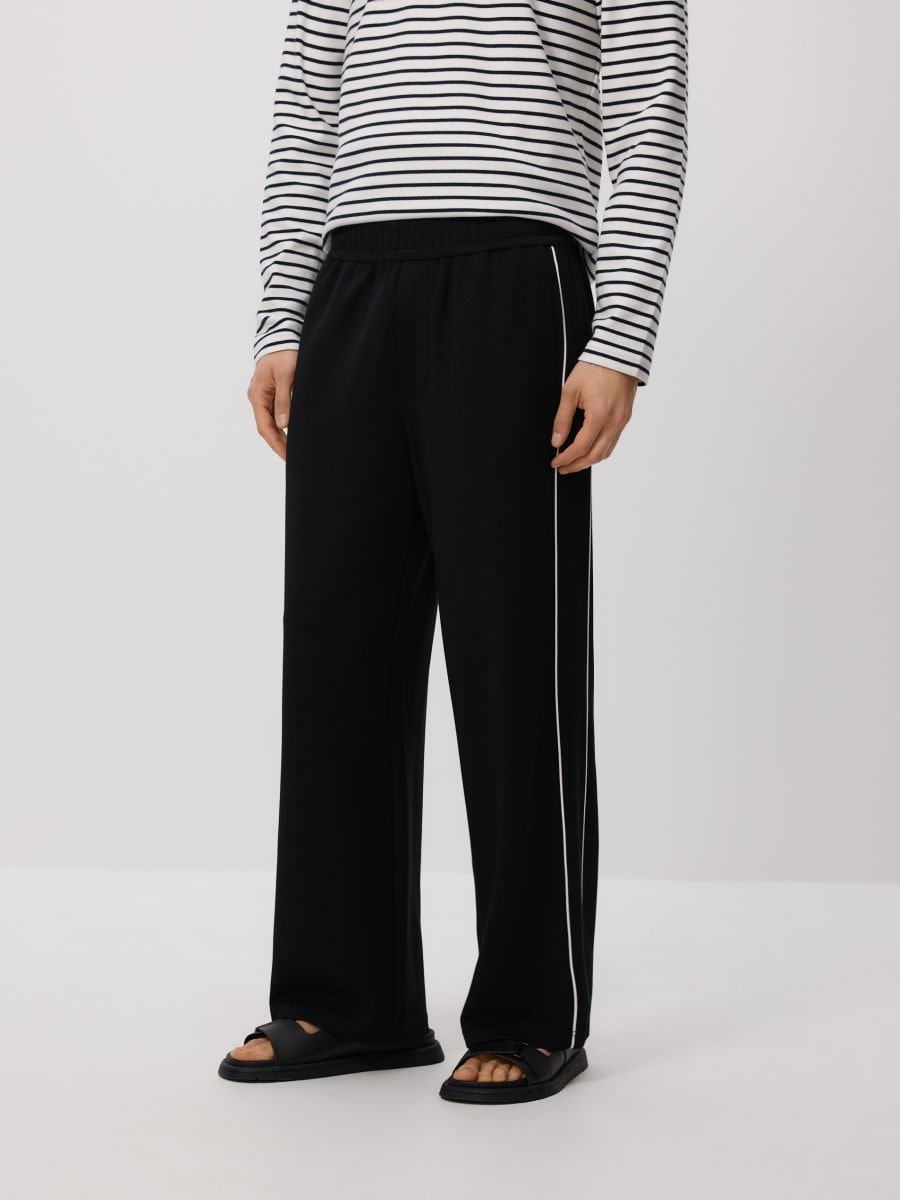 Spodnie loose fit - czarny - RESERVED