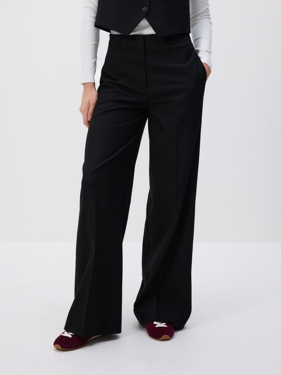 Trousers with pressed crease - black - RESERVED