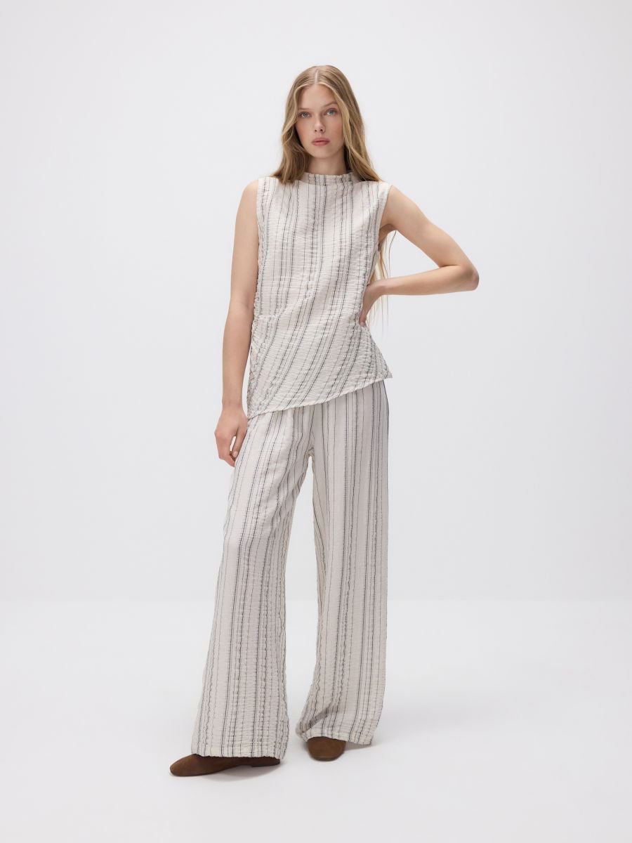 Loose trousers with metallic thread - beige - RESERVED - 3