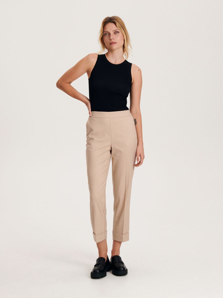 Trousers with pressed crease - beige - RESERVED