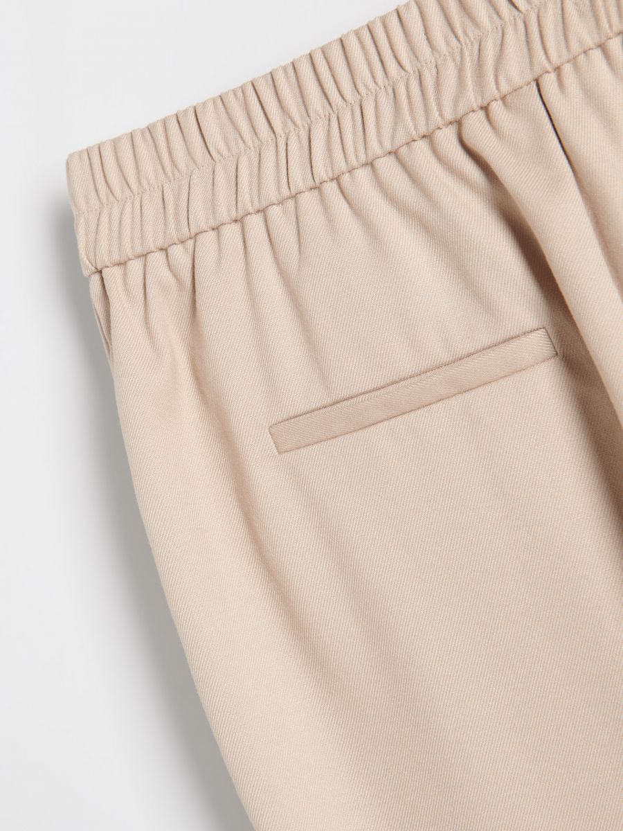 Trousers with pressed crease - beige - RESERVED - 5