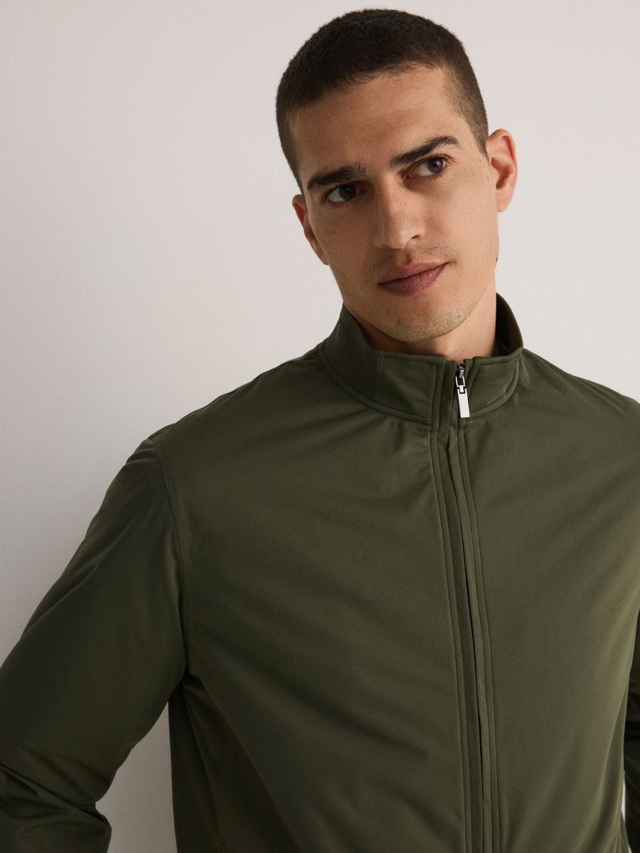 Self-stowing jacket - dusty green - RESERVED