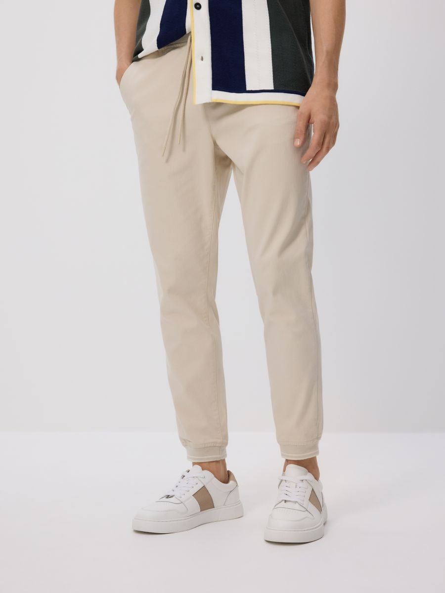 Spodnie jogger slim - kremowy - RESERVED