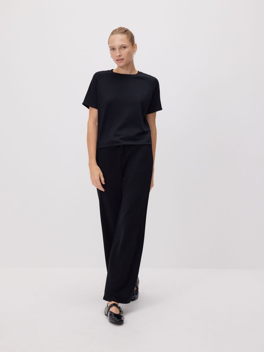 Pantalon large - noir - RESERVED