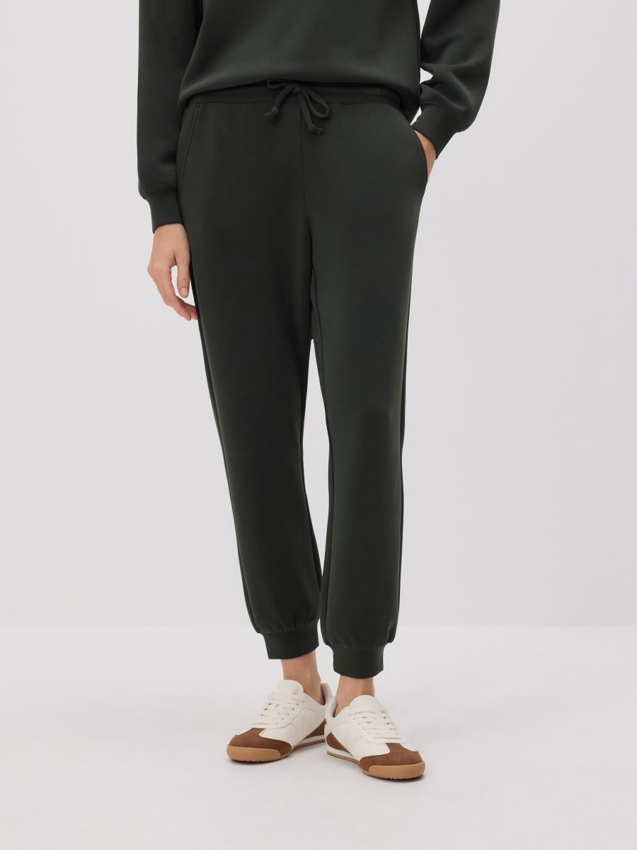 Sportske pantalone od modala - tamno zelena - RESERVED