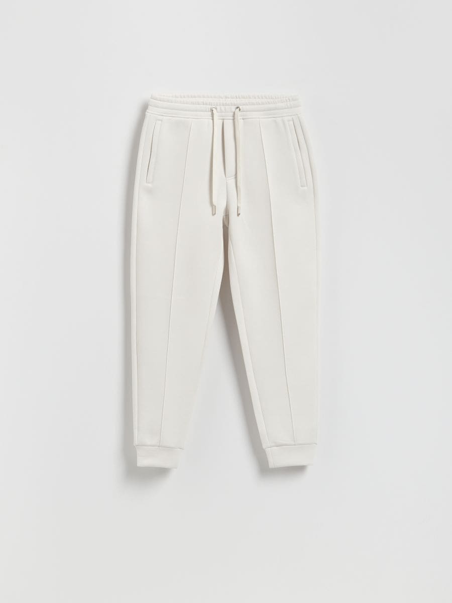 Spodnie dresowe slim fit - złamana biel - RESERVED