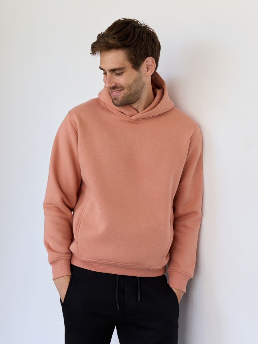 Peach coloured hoodie on sale