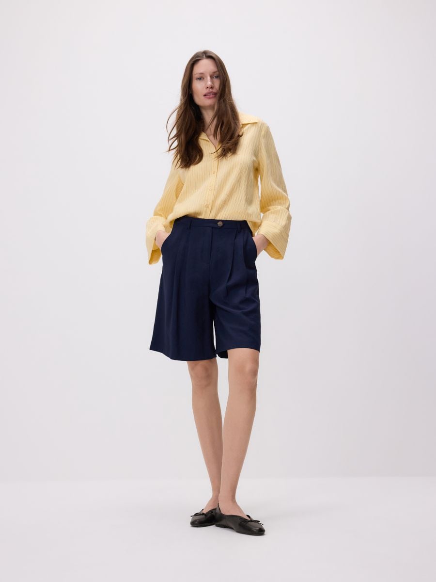 Bermudashort met plooien - marineblauw - RESERVED