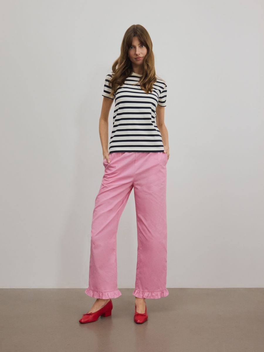 Trousers with ruffle detail - pink - RESERVED