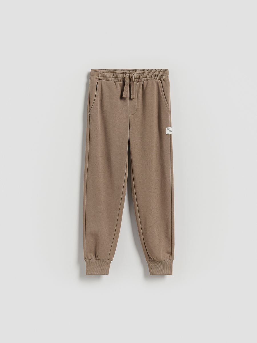 Bawełniane spodnie jogger - brązowy - RESERVED