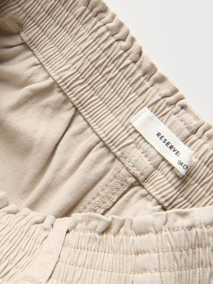 Trousers with chain detail - beige - RESERVED - 7