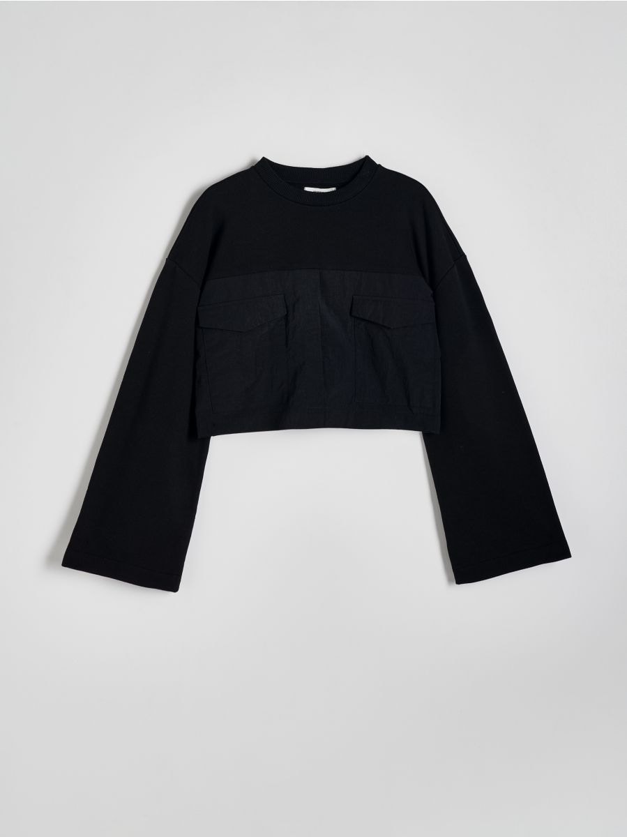 Kort sweatshirt i kombinerade material - SVART - RESERVED