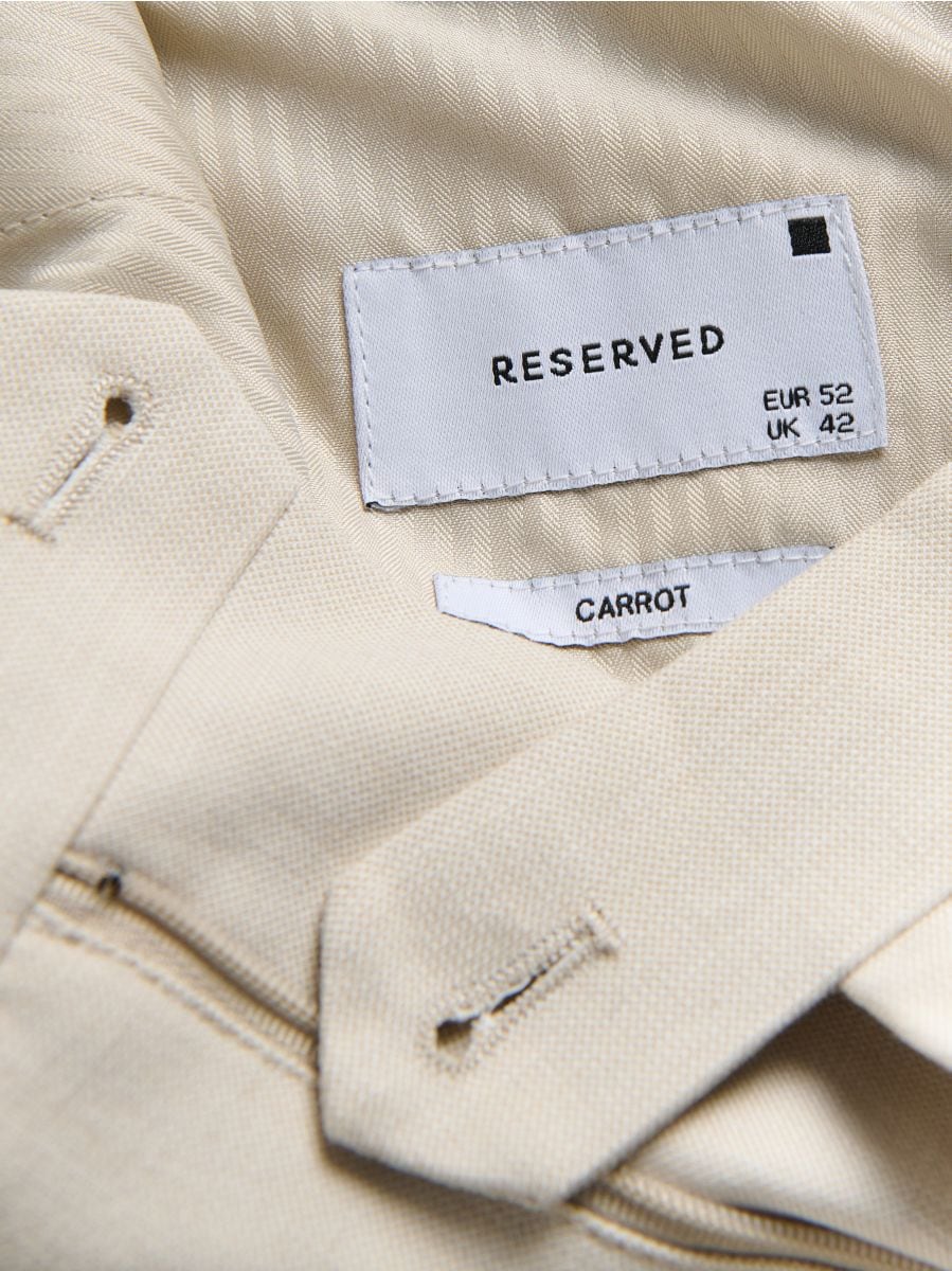 Suit trousers with pressed crease - beige - RESERVED - 4
