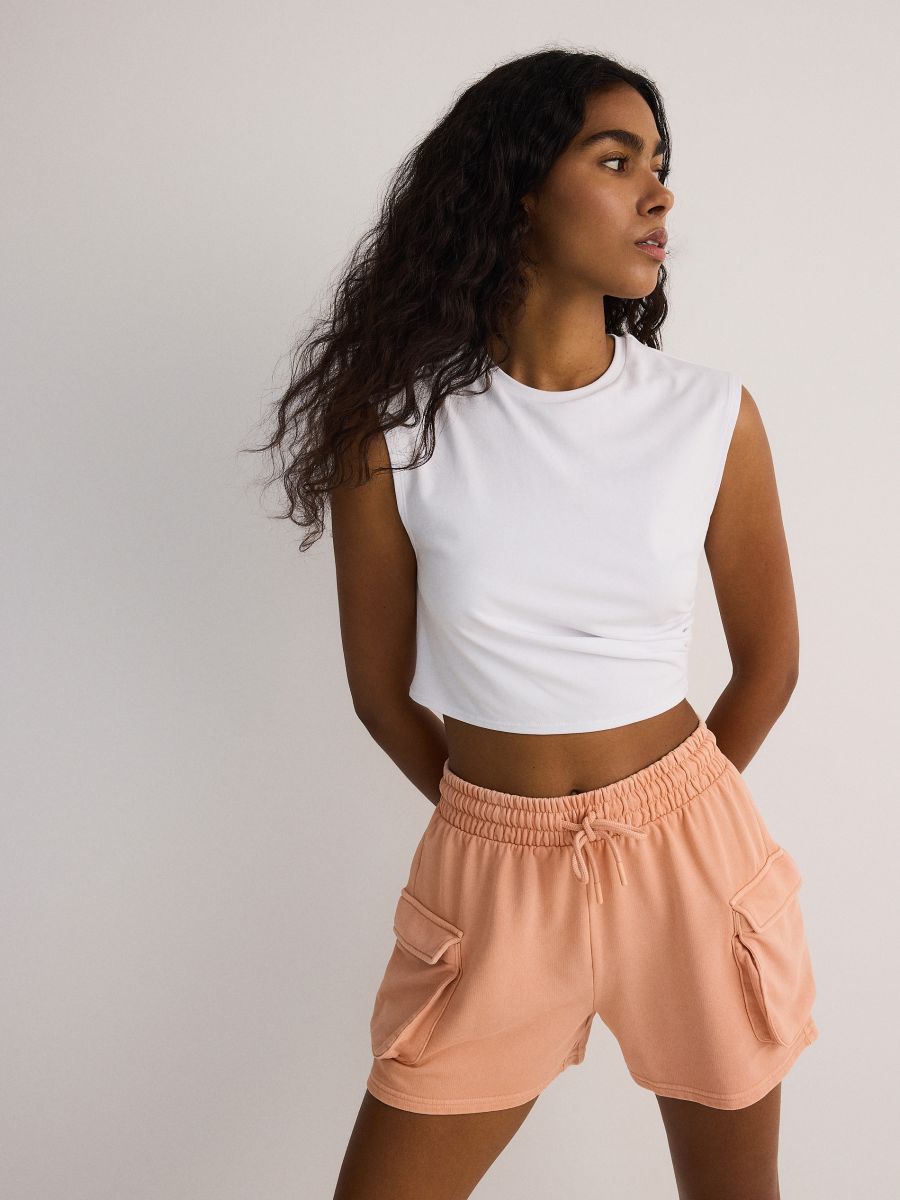 Shorts with cargo pockets - light orange - RESERVED