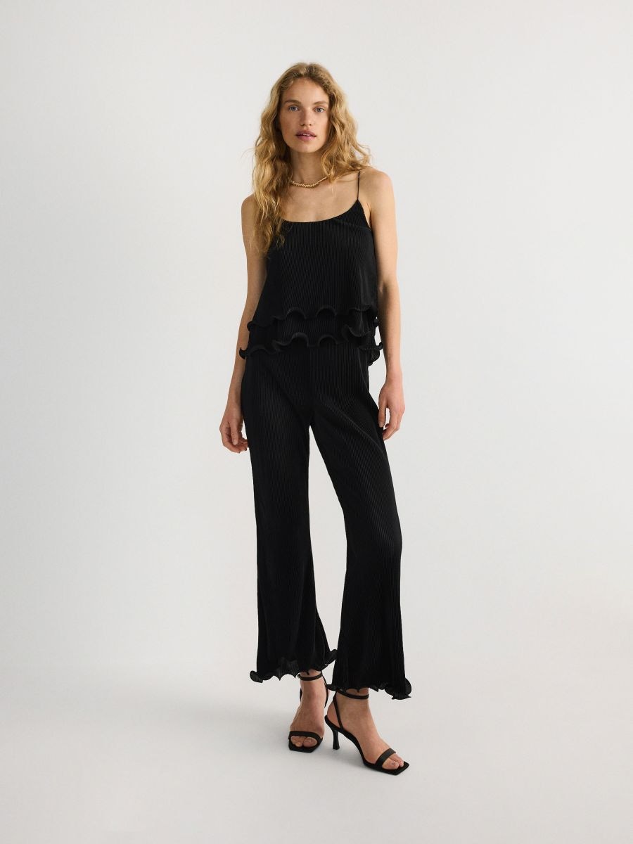Trousers with ruffle detail - black - RESERVED