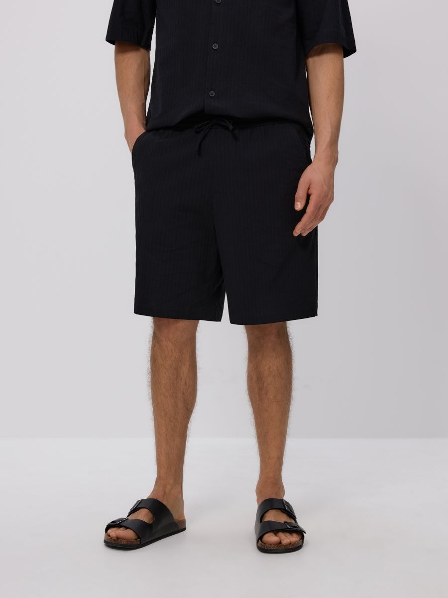 Loose structural shorts - black - RESERVED