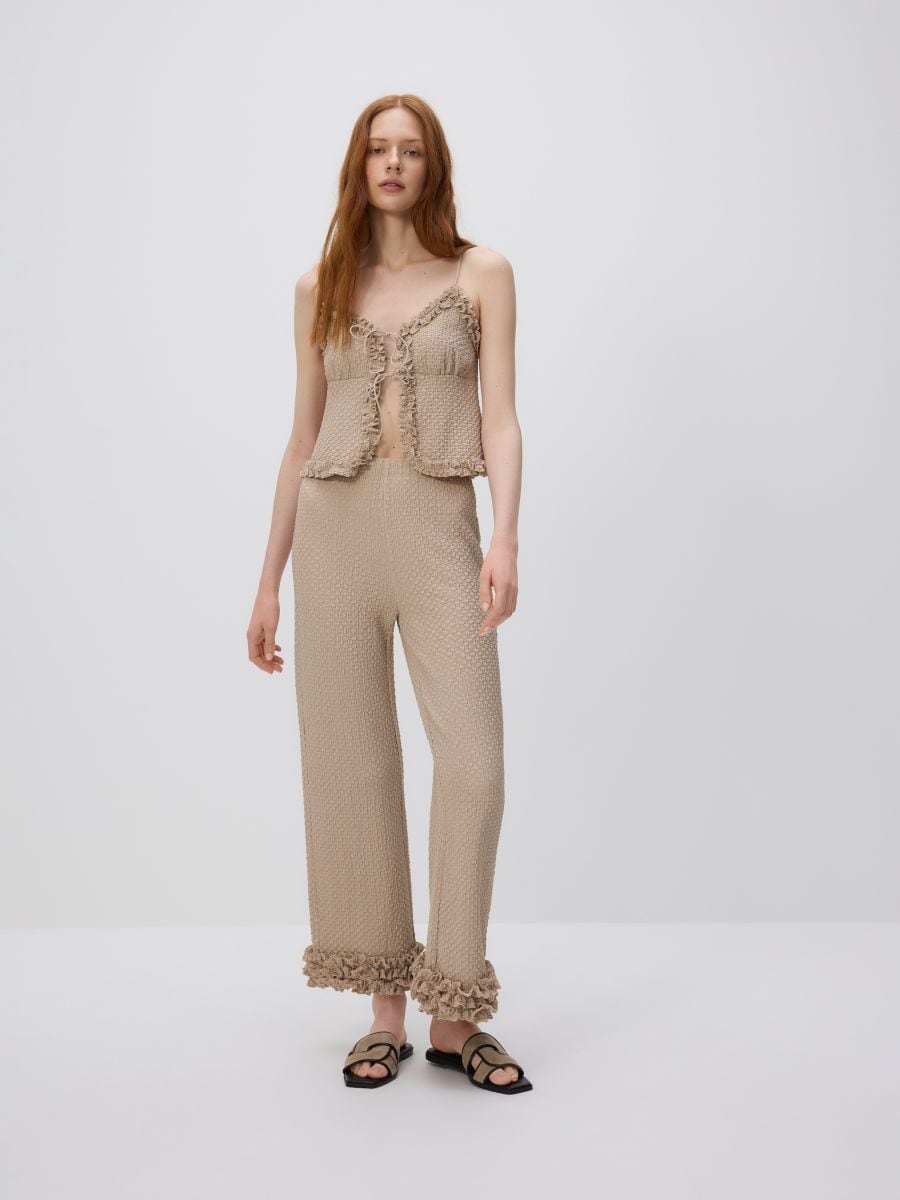 Trousers with ruffle detail - beige - RESERVED - 2