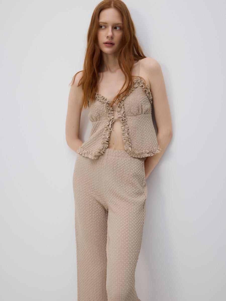 Trousers with ruffle detail - beige - RESERVED - 3