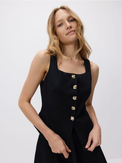 Vest with decorative buttons