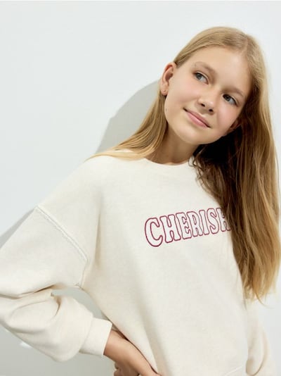 Hoodie with embroidered slogan
