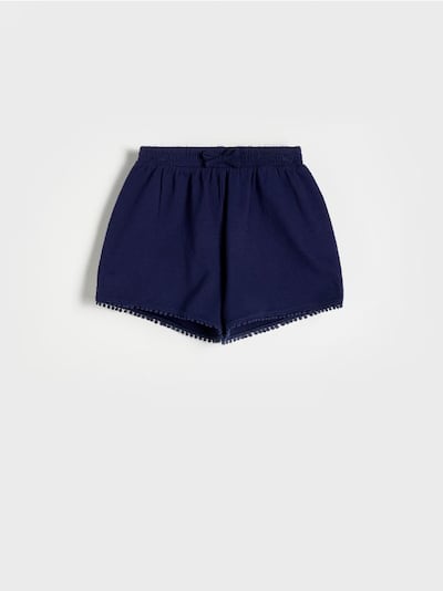 Shorts with decorative tape detail