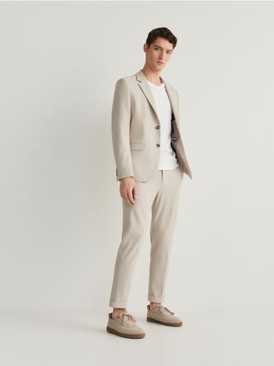 Suit trousers with pressed crease