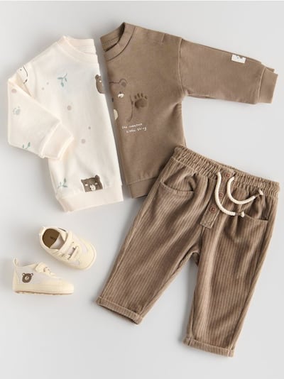Trousers with tie detail