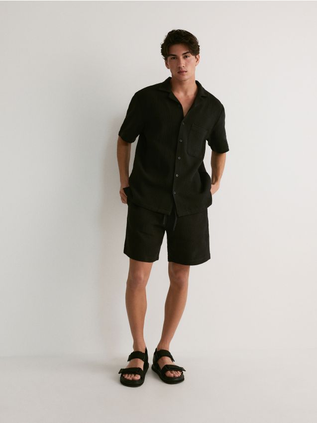 Reserved - pantaloni scurți jogger din muselină - negru