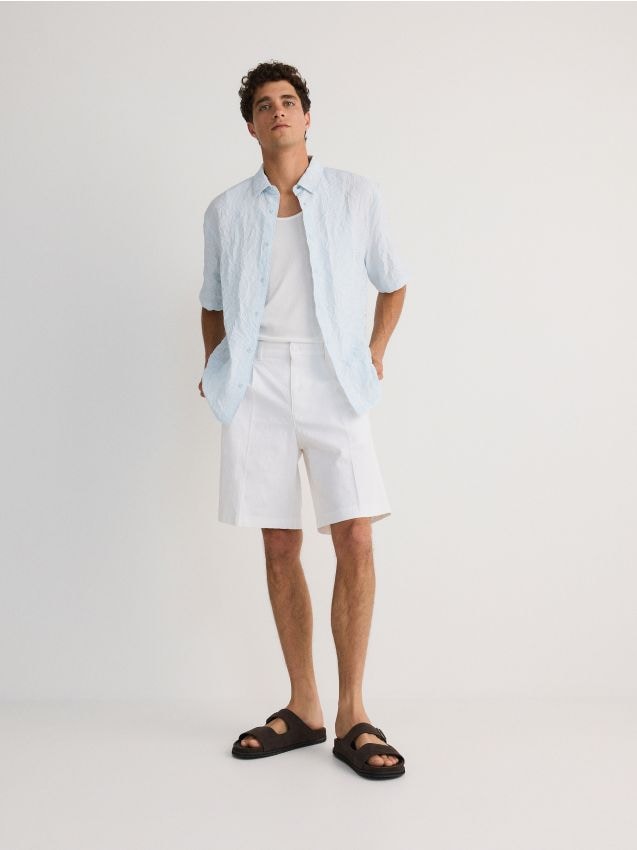 Chino shorts with pressed crease - RESERVED