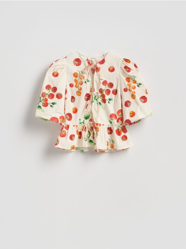Blus med knytning och peplum - RESERVED