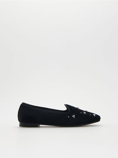 Loafers with decorative details