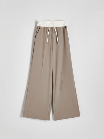Trousers with contrast insert