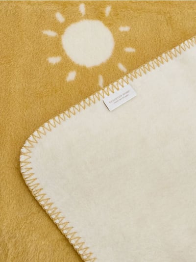 Κουβέρτα διπλής όψης με μοτίβο με ήλιο