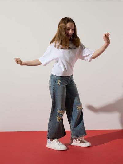 Jeansy super wide leg z przetarciami
