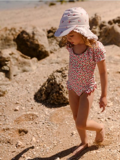 One-piece swimsuit with flounce