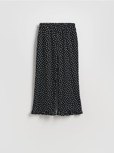Polka‑dot ruffle trousers