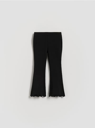 Flare trousers with ruffle details