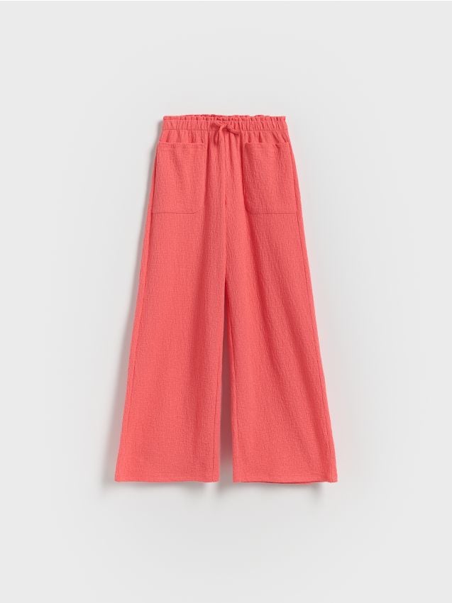 Reserved - Pantaloni din tricot, cu structură și buzunare - corai Reserved - Pantaloni din tricot, cu structură și buzunare - corai