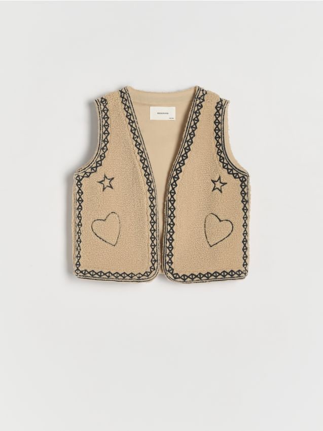 Väst med broderade detaljer - RESERVED