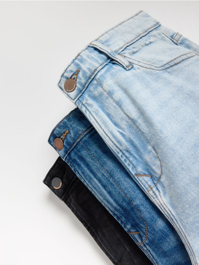 Reserved - Blugi carrot slim cu aspect deteriorat - albastru